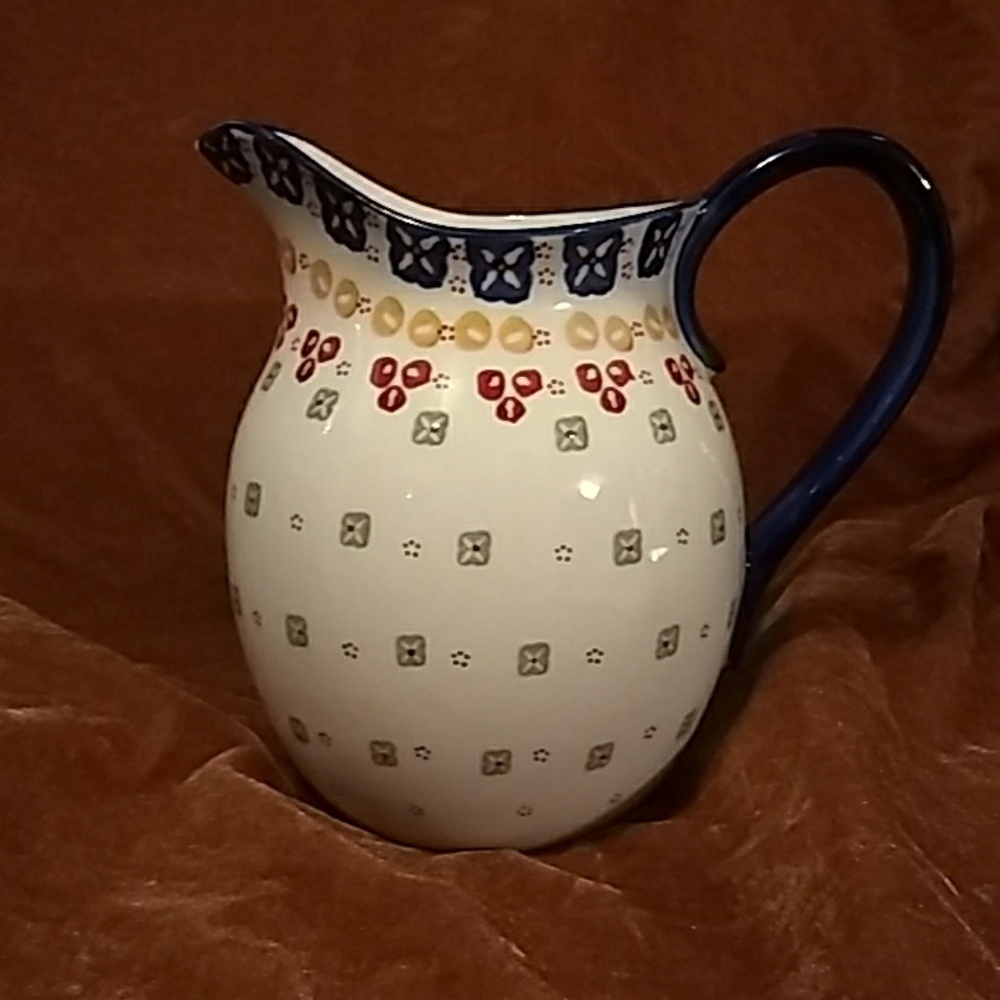 Pretty, painted pitcher. About 7 inches tall.